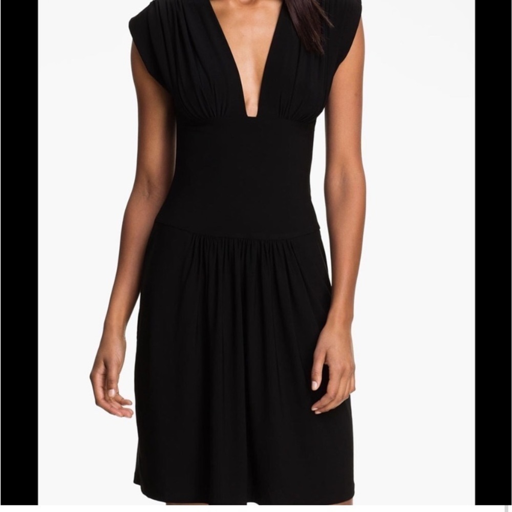 Norma Kamali deep v neck, fit and flare black dress, size medium